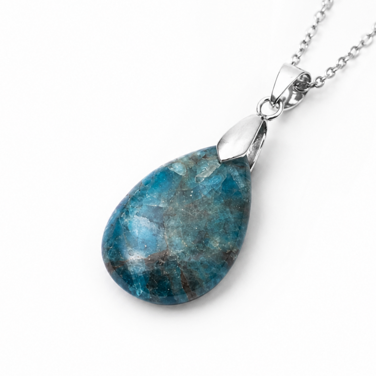 A teardrop-shaped blue apatite stone pendant necklace with a polished silver-toned metal cap and a silver chain, shown on a clean white background.