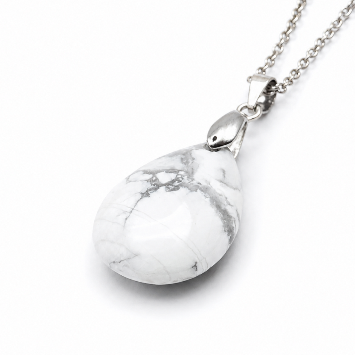 A silver teardrop pendant necklace featuring a white howlite stone with gray veining, shown on a clean white background.